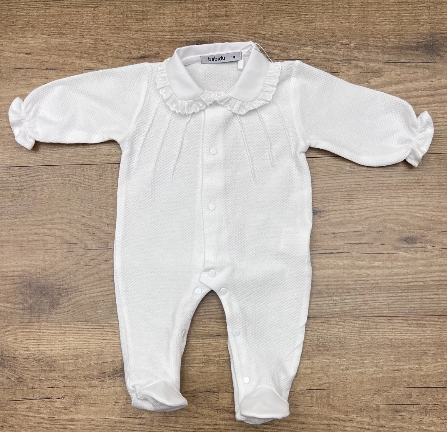 Romper or pajamas in two colors. Patuco Collection